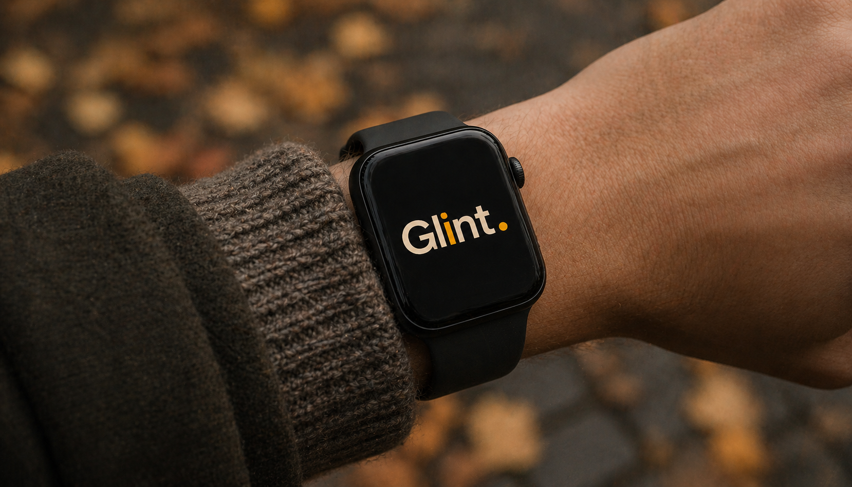 An Apple Watch on a wooden table with a steaming mug nearby